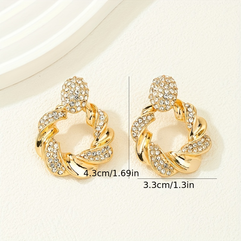 Hollow Twisted Pattern Dangle Earrings with Rhinestone Inlay
